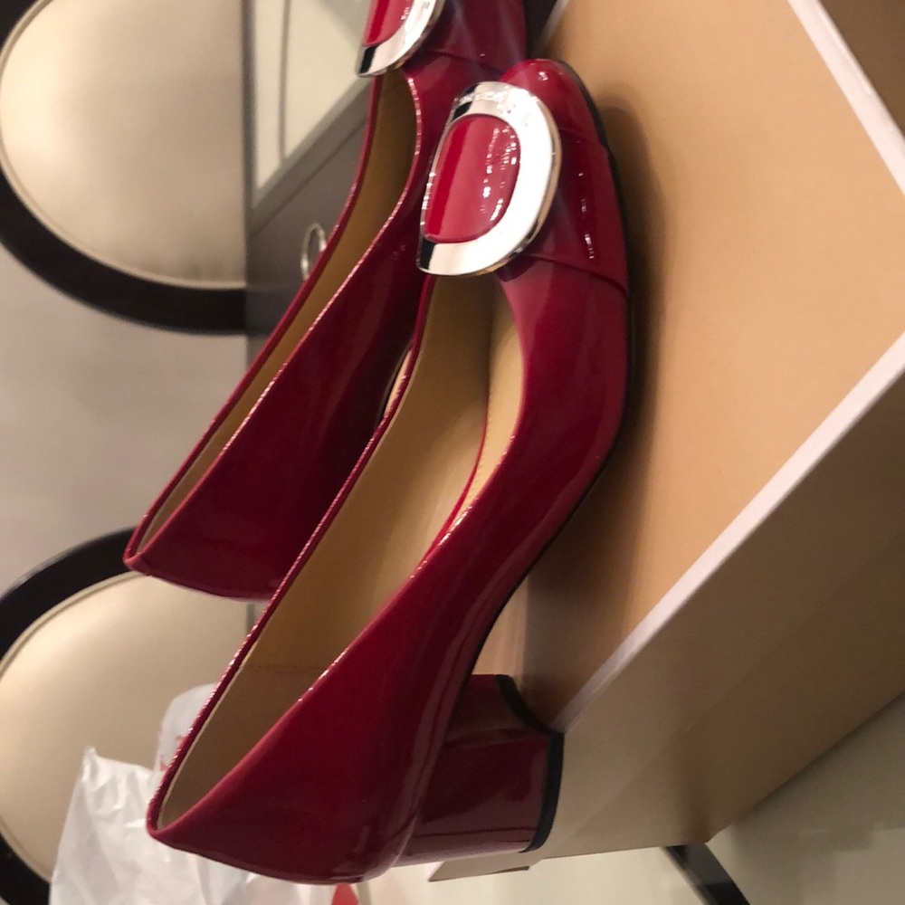 Red patent pumps